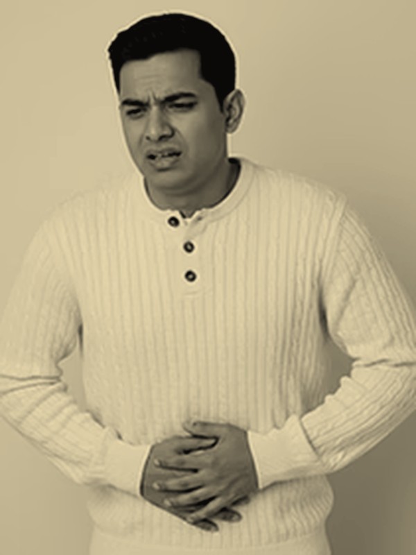 Man with digestive discomfort, detox concern