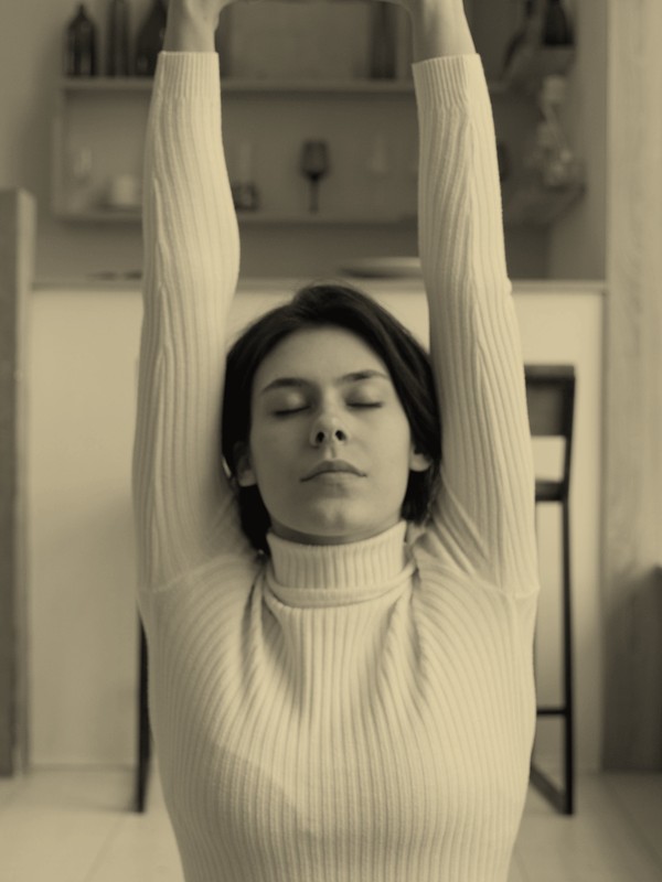 Woman doing morning stretches, metabolism concern