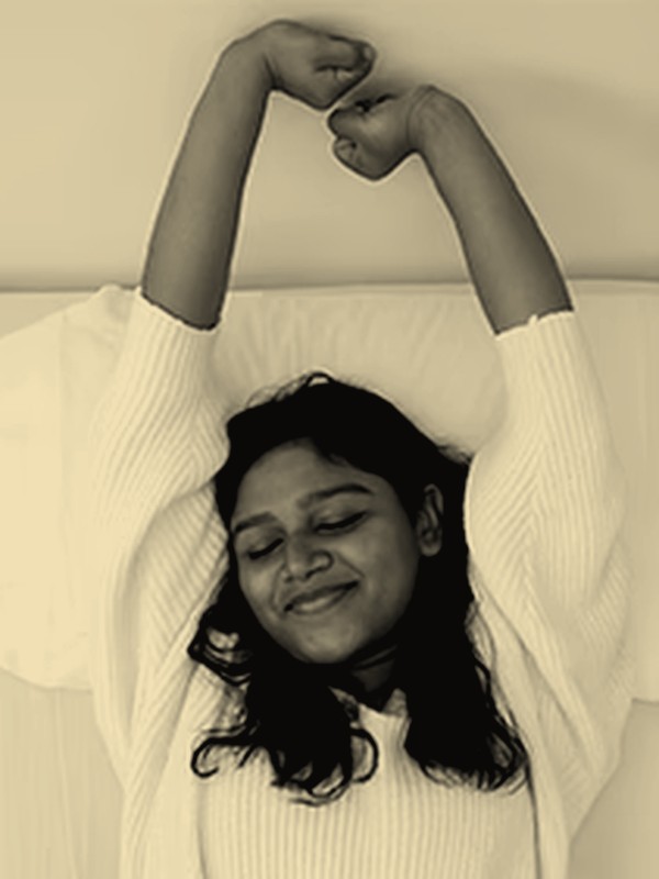 Woman waking up well-rested, sleep concern